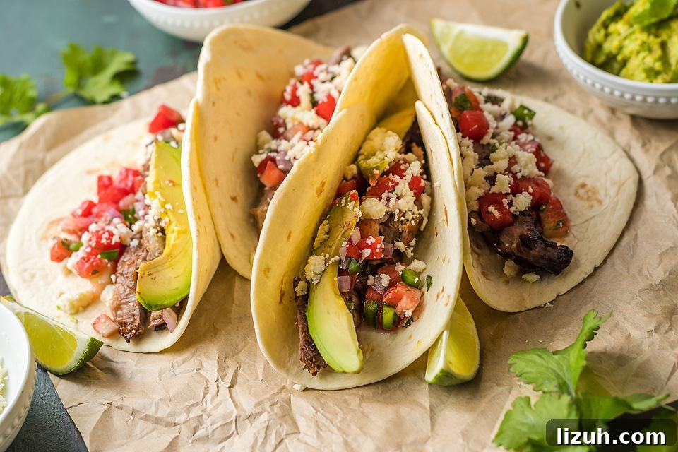 27 Delicious Taco Recipes for Any Night of the Week 2 Steak tacos on a cutting board.