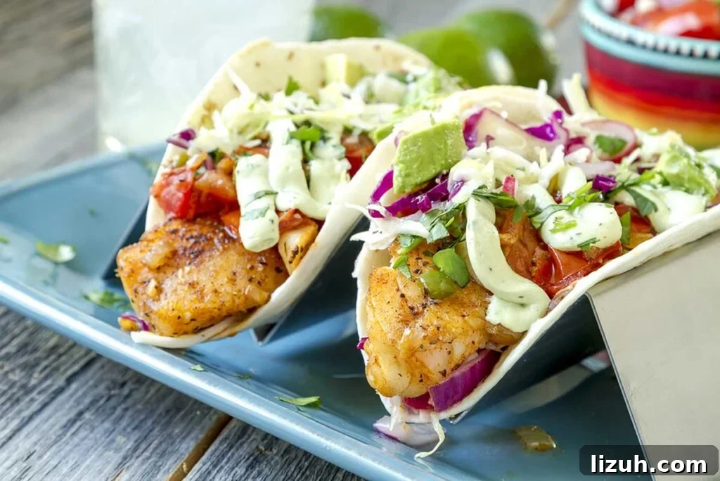27 Delicious Taco Recipes for Any Night of the Week 18 Beer battered fish tacos on a plate.