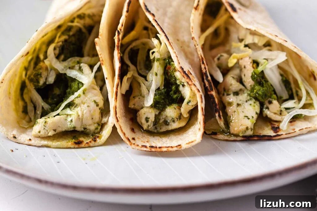 27 Delicious Taco Recipes for Any Night of the Week 19 Three chicken chimichurri tacos on a plate