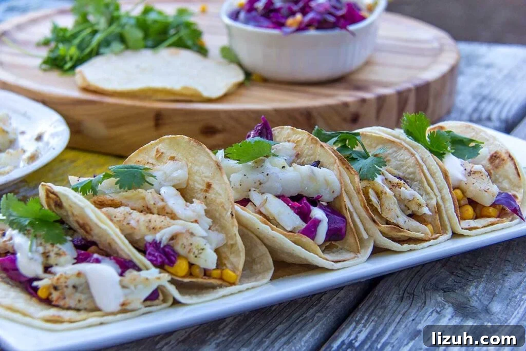 27 Delicious Taco Recipes for Any Night of the Week 20 A plate of fish tacos with cabbage and corn.