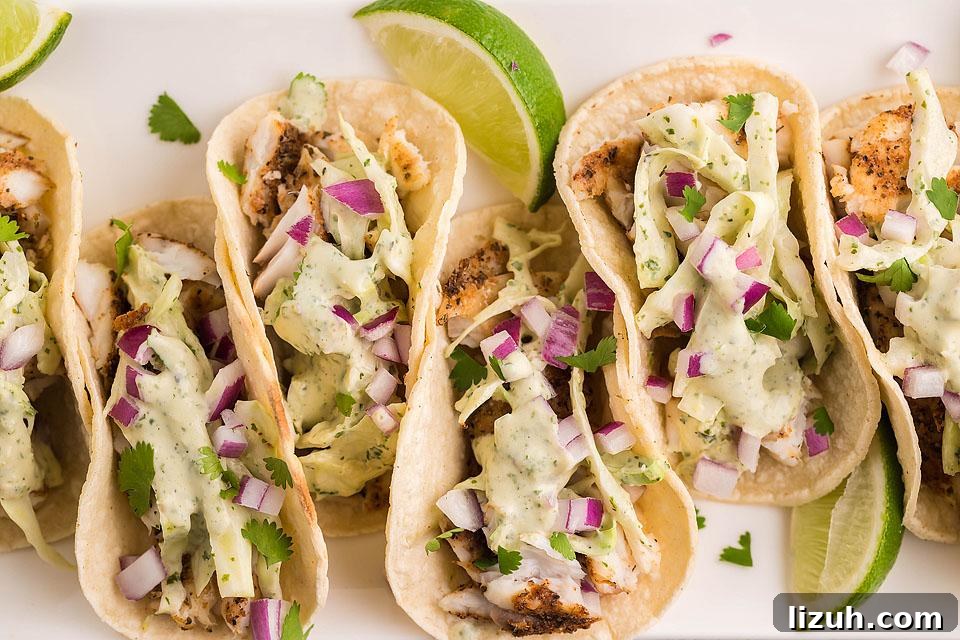 27 Delicious Taco Recipes for Any Night of the Week 3 Fish tacos on a white platter.
