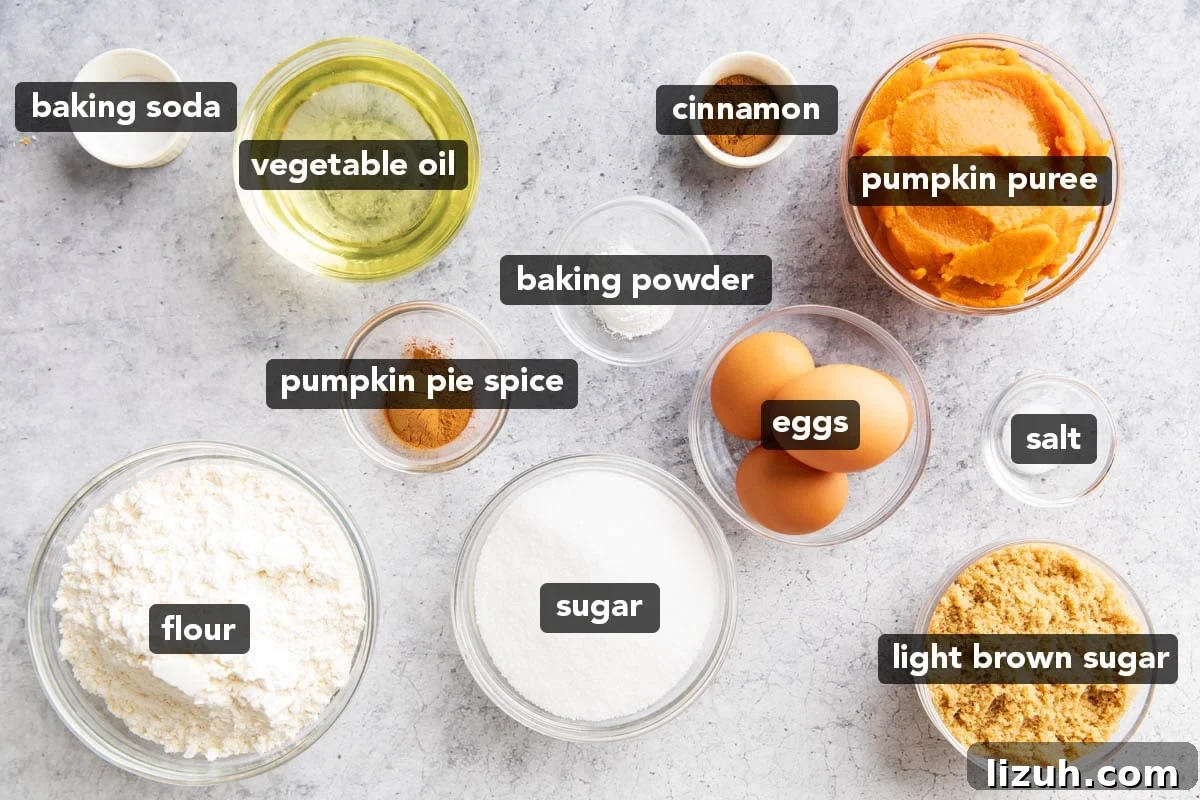 Pumpkin Cake with cream cheese frosting ingredients include flour, pumpkin, oil, sugar, brown sugar, pumpkin pie spice, cinnamon, and more