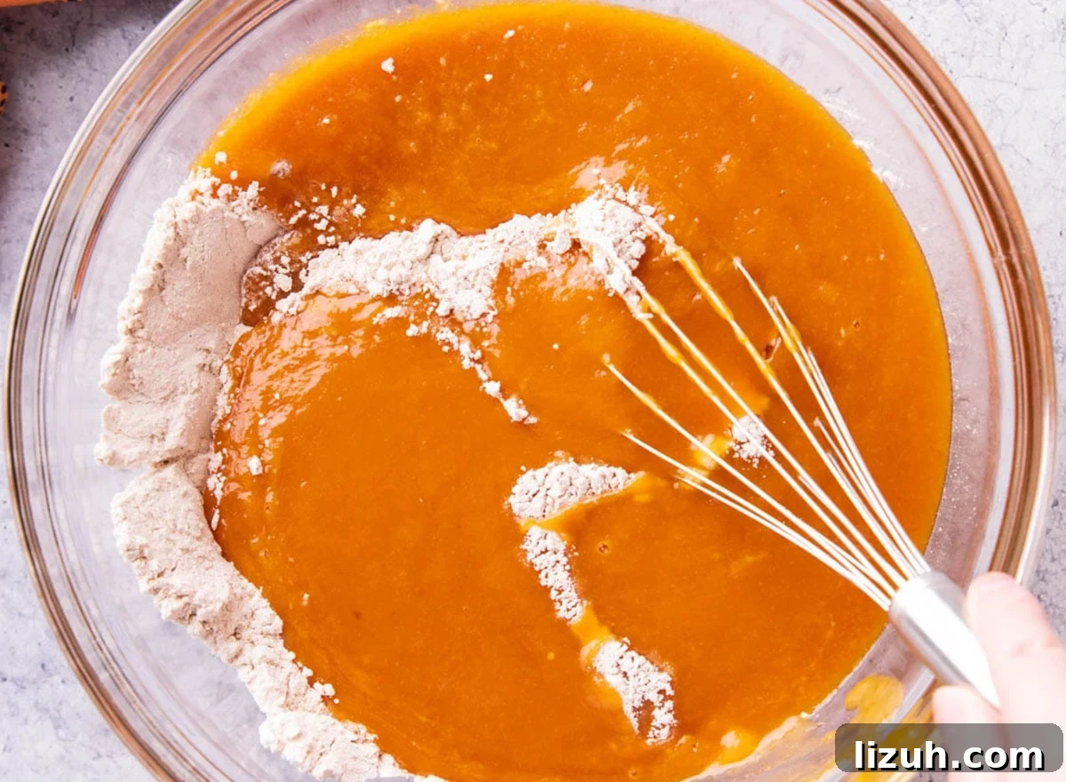 Combining wet and dry ingredients to make the batter
