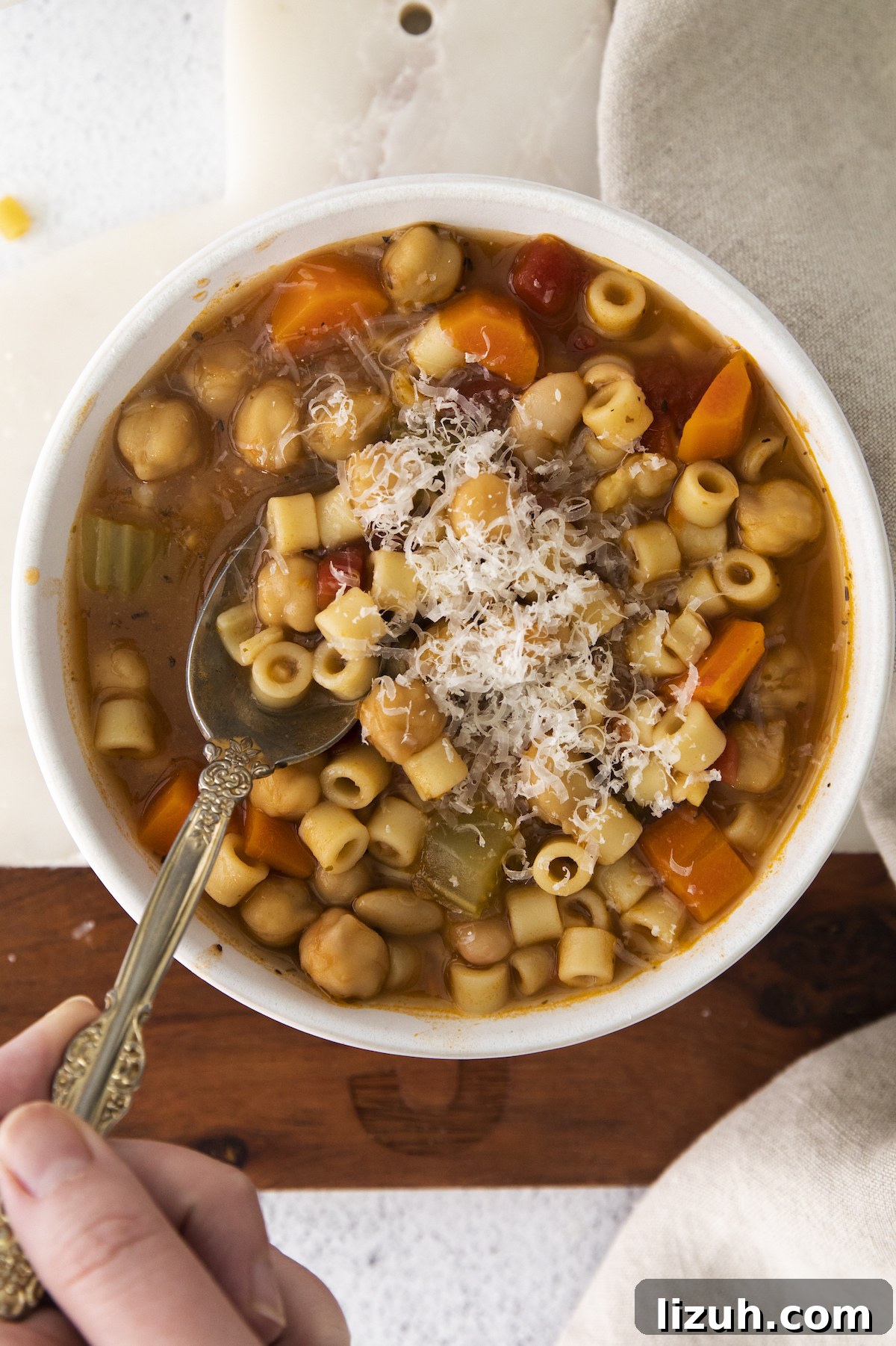 Creamy Chickpea Soup Recipe for Cozy Weeknight Meals 7 the completed chickpea soup being stirred with a spoon