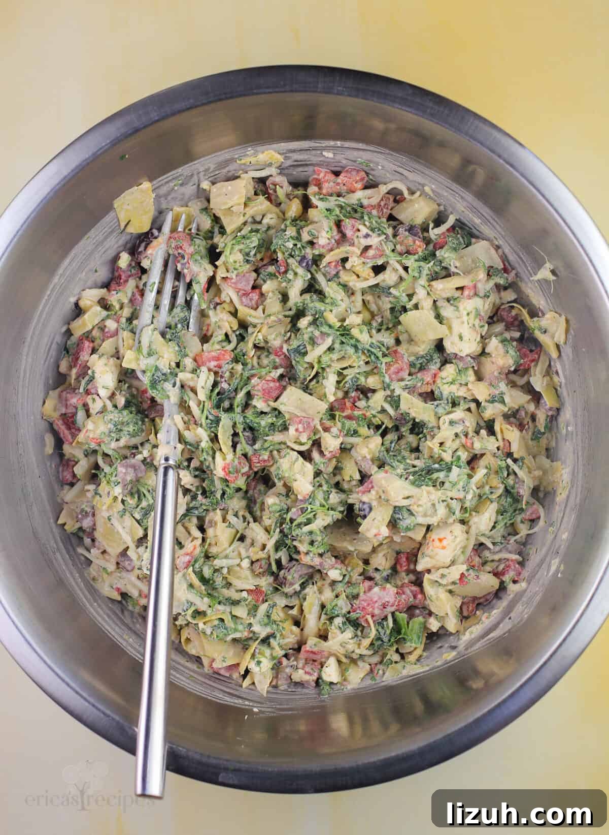 filling ingredients in mixing bowl with fork