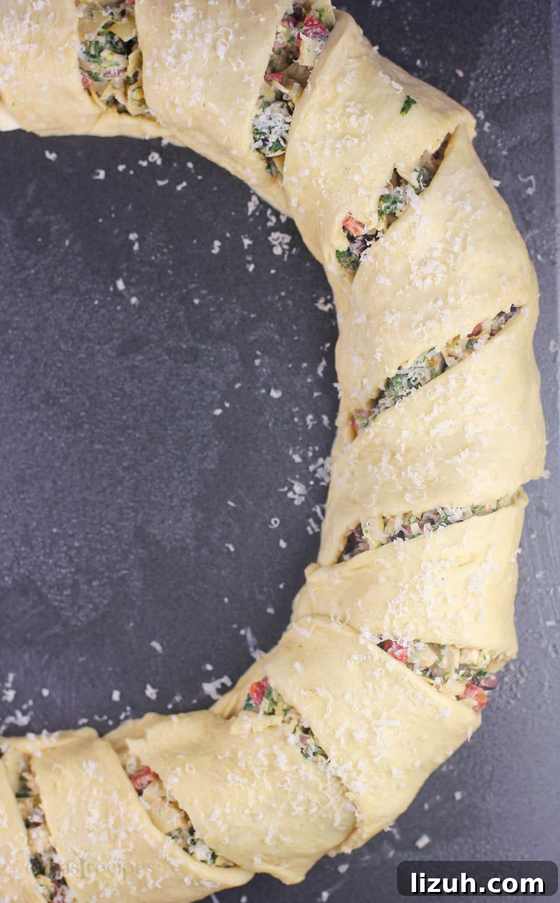 crescent ring, assembled and topped with cheese before baking