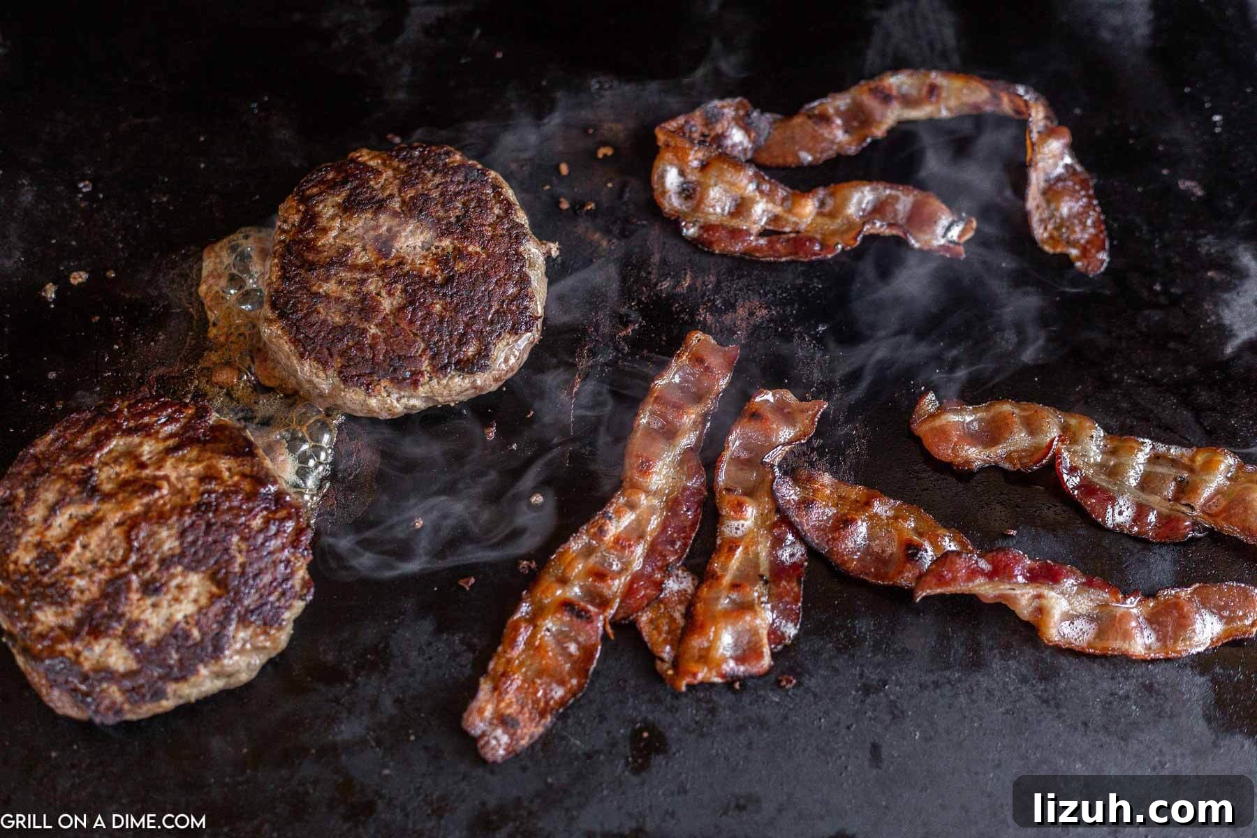 Cooking burger patties and bacon on the griddle