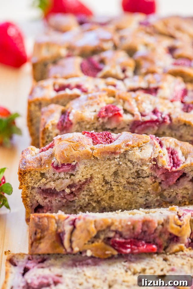 A sliced loaf of The Best Strawberry Banana Bread. 