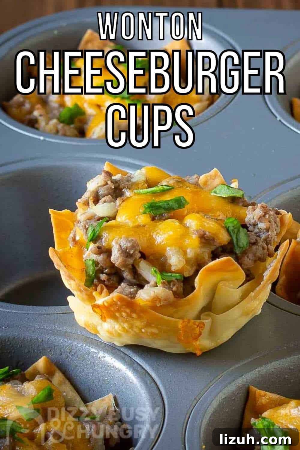 Crispy Wonton Cheeseburger Cups — Bite-Sized Party Sliders 2 Side shot of a wonton cheeseburger cup sitting on the flat part of a cupcake sheet with more in the background.